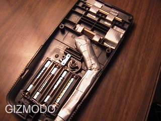 Illustration for article titled Dude Puts a Pipe in a TI-83 Calculator; Calculator Still Works